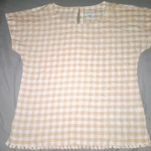 Blouse.  Short sleeve. Small tassels on the bottom looks new